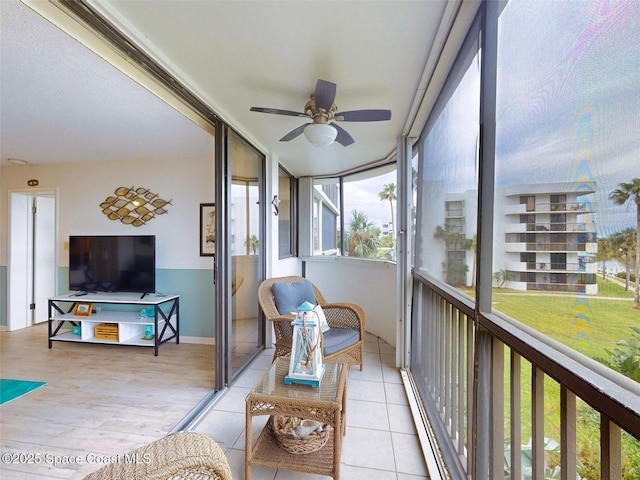 sunroom / solarium with ceiling fan