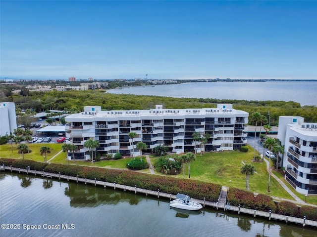 birds eye view of property featuring a water view