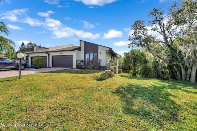 3425 Pheasant Ct, Melbourne, FL 32935 - view of front facade with a garage and a front yard
