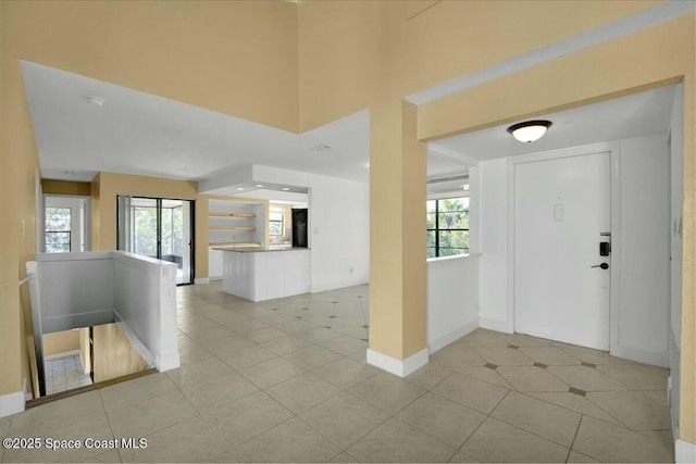 foyer with light tile patterned floors