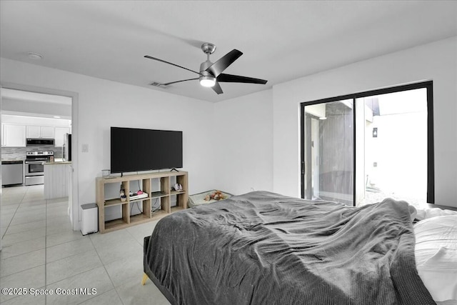 bedroom with light tile patterned floors, ceiling fan, and refrigerator