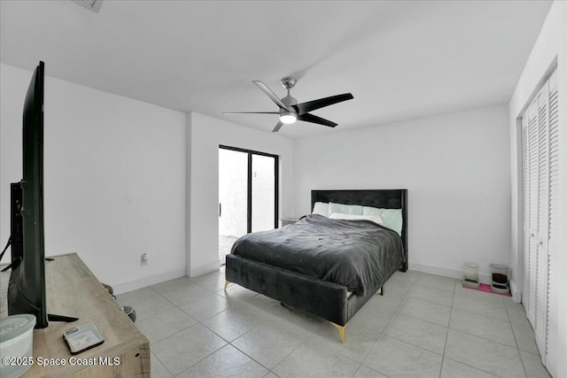 tiled bedroom with ceiling fan