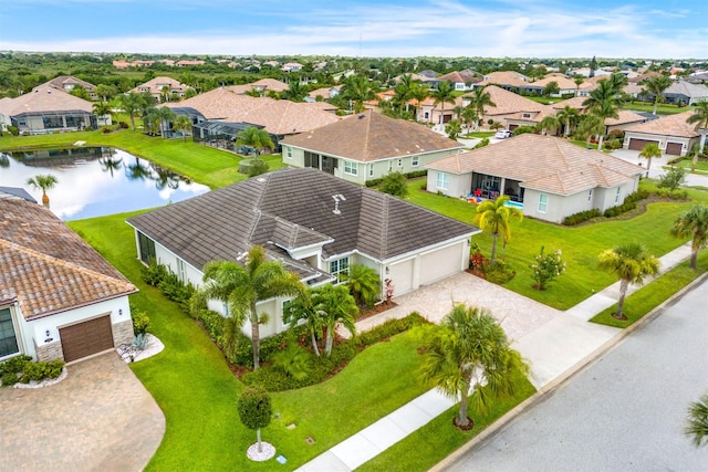 birds eye view of property with a water view