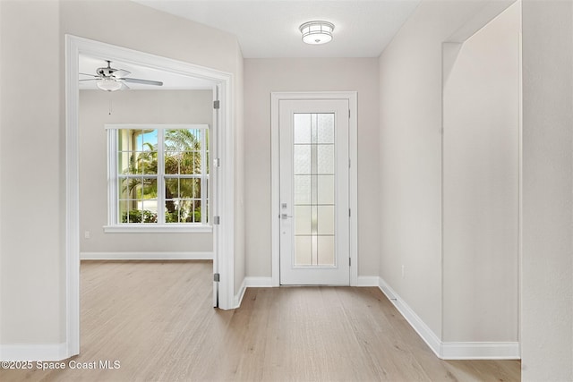 doorway featuring light hardwood / wood-style flooring and ceiling fan