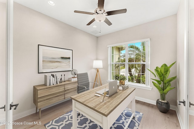 office area featuring ceiling fan and light wood-type flooring