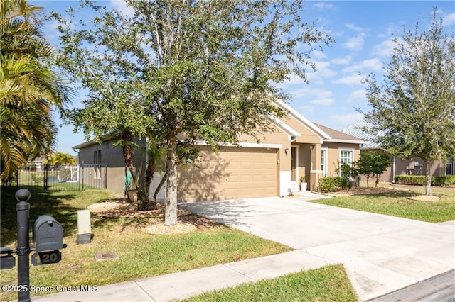 view of front of home with a garage and a front lawn