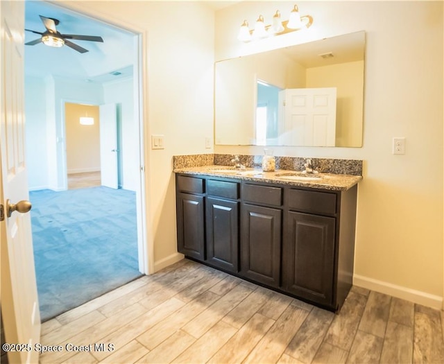 bathroom featuring vanity and ceiling fan