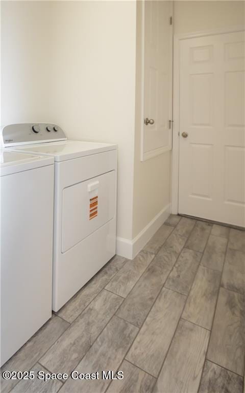 washroom featuring washing machine and dryer