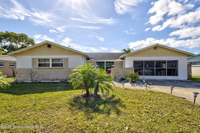 ranch-style home with a front lawn