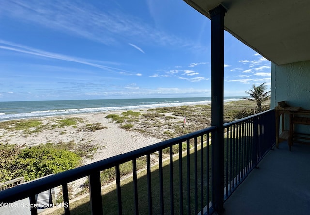 balcony with a view of the beach and a water view