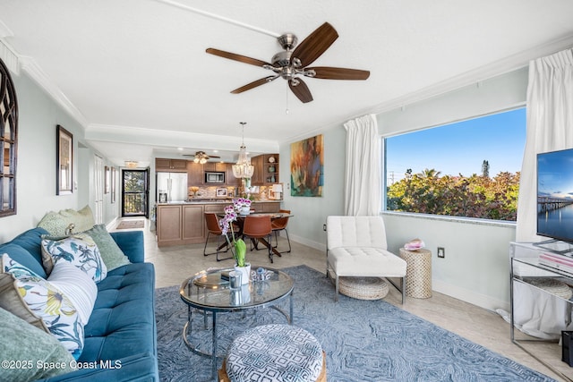 living room with ornamental molding and ceiling fan