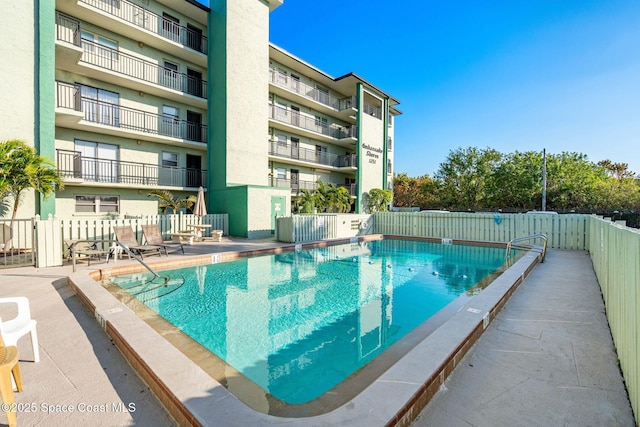 view of pool featuring a patio area