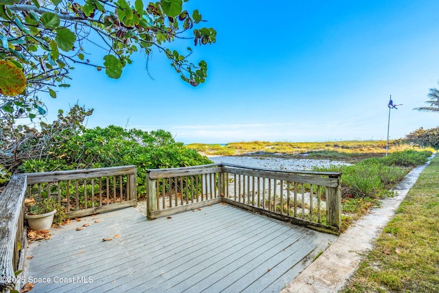 deck featuring a water view