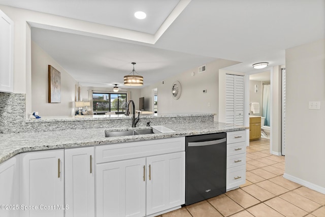 kitchen with dishwasher, light stone countertops, sink, and white cabinets