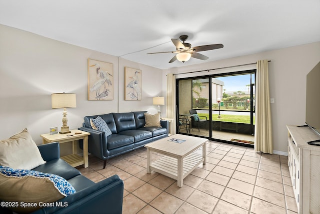 tiled living room with ceiling fan