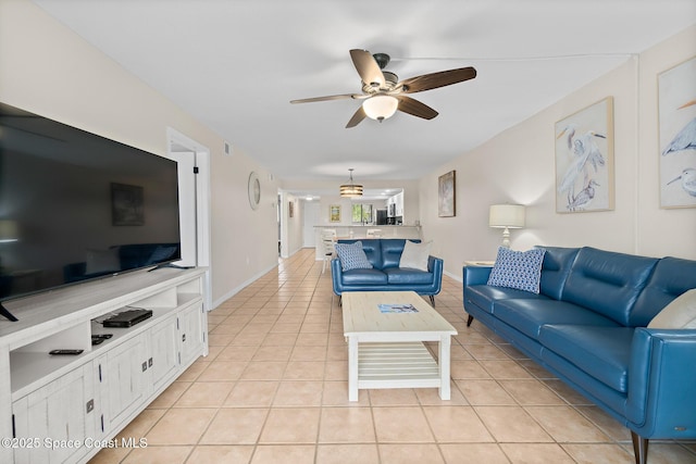 tiled living room with ceiling fan