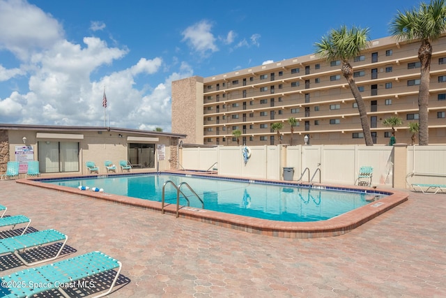 view of swimming pool featuring a patio area