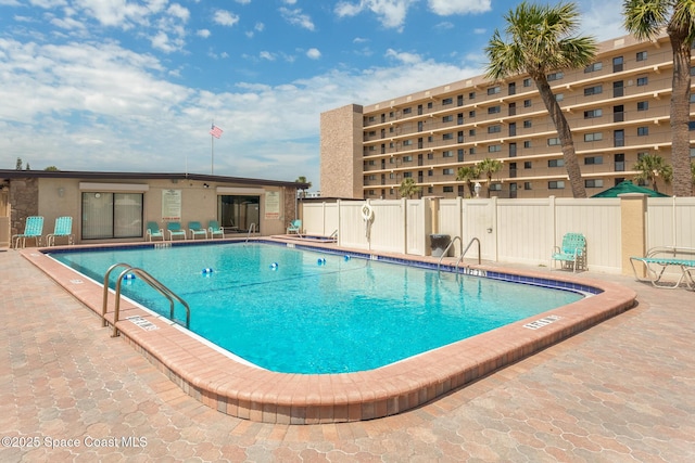 view of swimming pool with a patio area