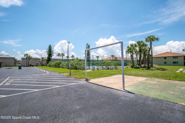 view of car parking featuring a yard