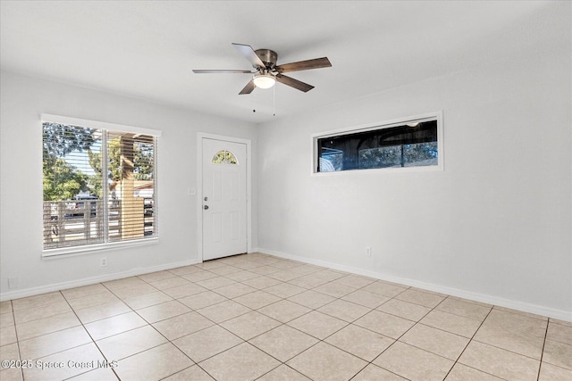 interior space featuring ceiling fan and light tile patterned flooring