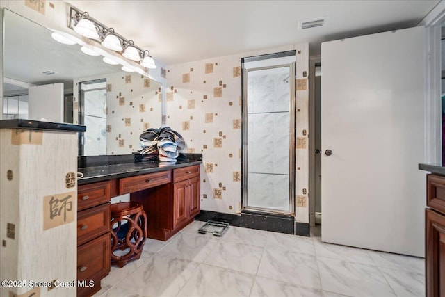 bathroom with vanity and walk in shower