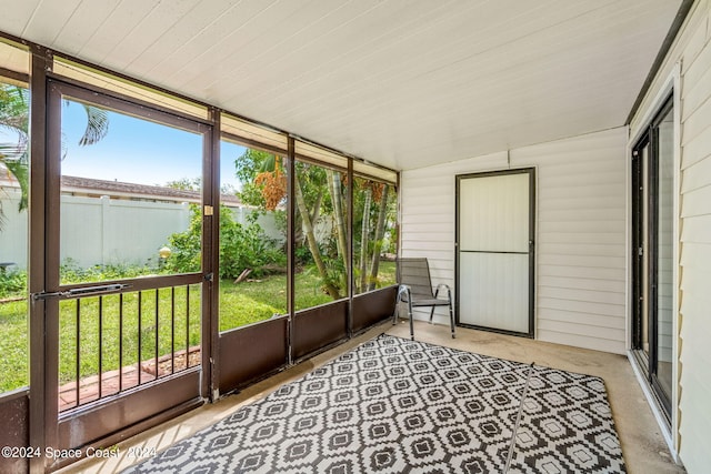 sunroom featuring lofted ceiling