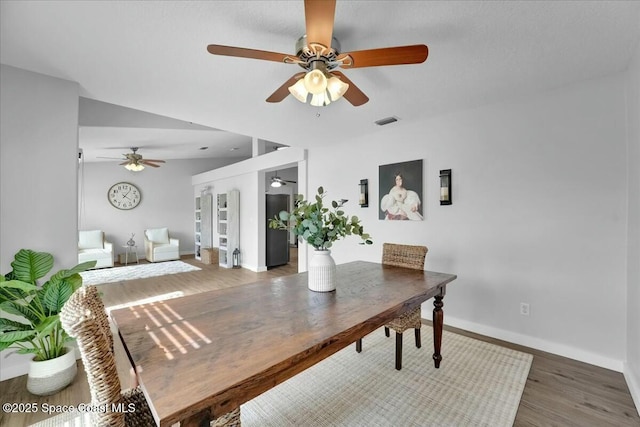 dining area with hardwood / wood-style floors