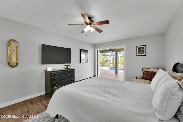 bedroom featuring hardwood / wood-style floors, a textured ceiling, ceiling fan, and access to exterior