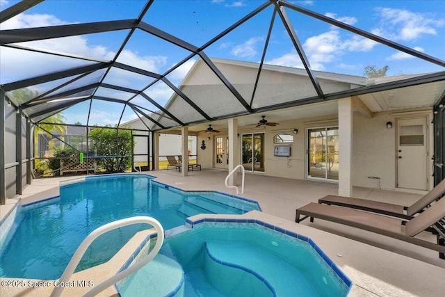 view of swimming pool featuring a lanai, a patio area, ceiling fan, and an in ground hot tub