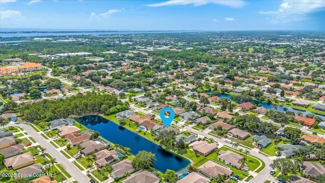 drone / aerial view with a water view