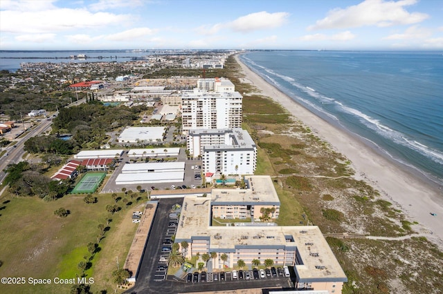 drone / aerial view featuring a view of the beach and a water view