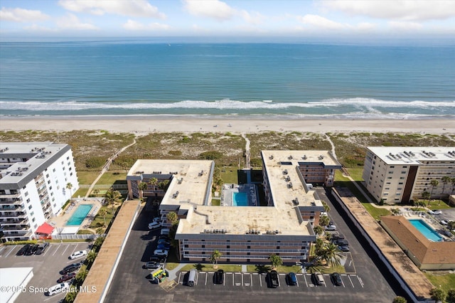 drone / aerial view with a view of the beach and a water view