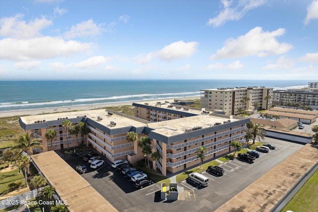 aerial view with a view of the beach and a water view