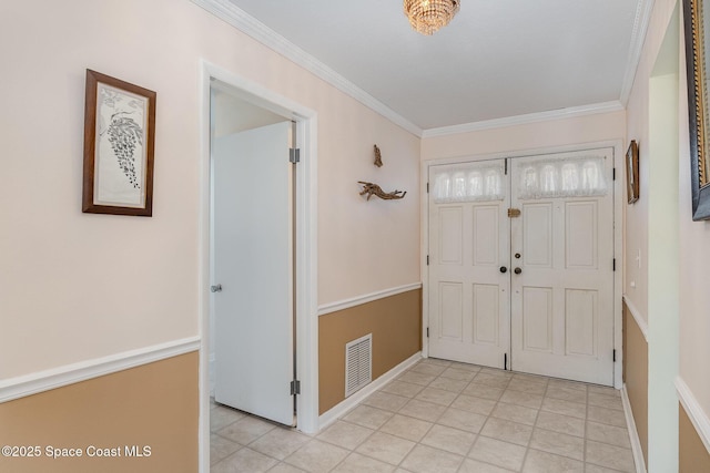 entryway with light tile patterned flooring, baseboards, visible vents, and ornamental molding