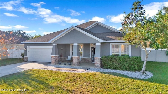 craftsman house featuring a garage, a front yard, and a porch