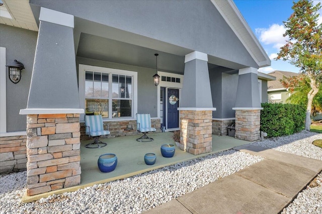 entrance to property featuring covered porch