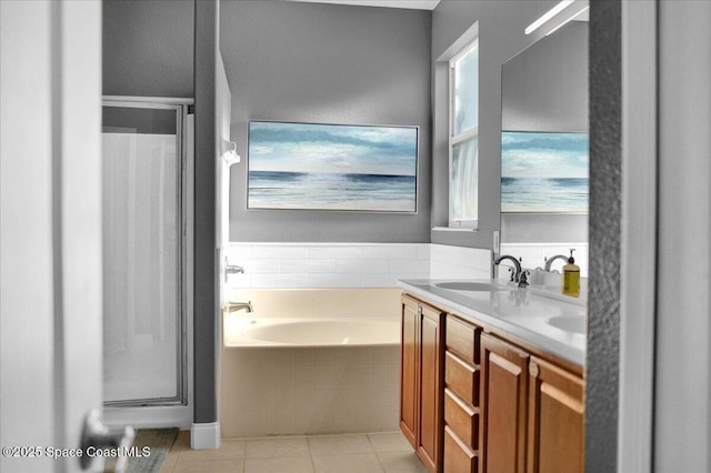 bathroom with tile patterned flooring, vanity, and plus walk in shower