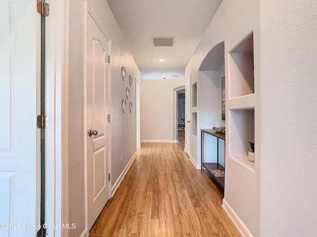 corridor featuring light wood-type flooring