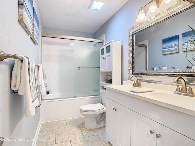 full bathroom with bath / shower combo with glass door, tasteful backsplash, vanity, toilet, and tile patterned floors