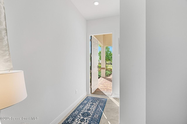 entryway with light tile patterned floors