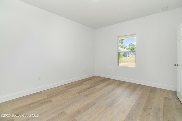 spare room featuring light hardwood / wood-style floors