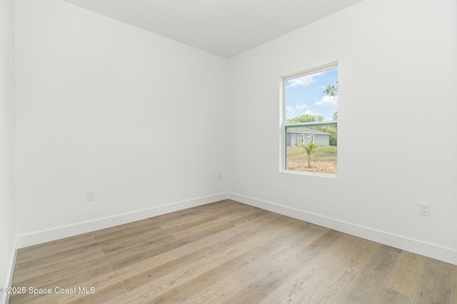 unfurnished room featuring light wood-type flooring