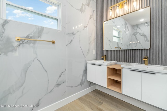 bathroom with wood-type flooring and vanity