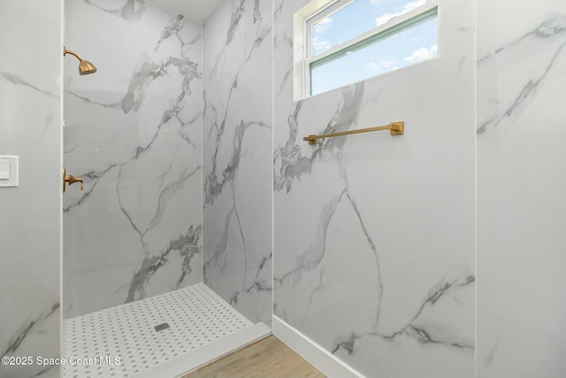 bathroom featuring wood-type flooring and walk in shower