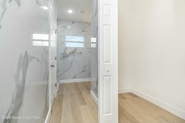 bathroom with hardwood / wood-style floors