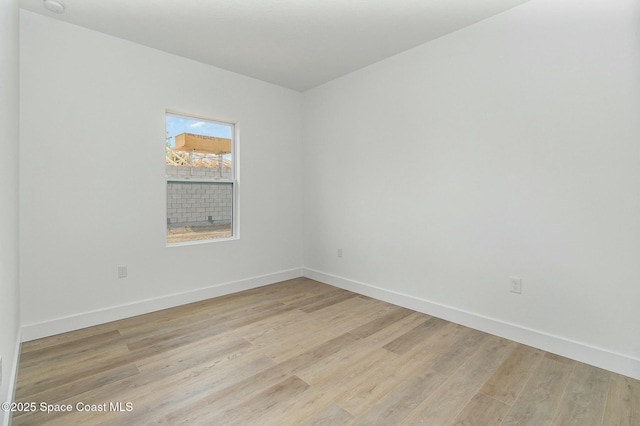 spare room featuring light hardwood / wood-style floors