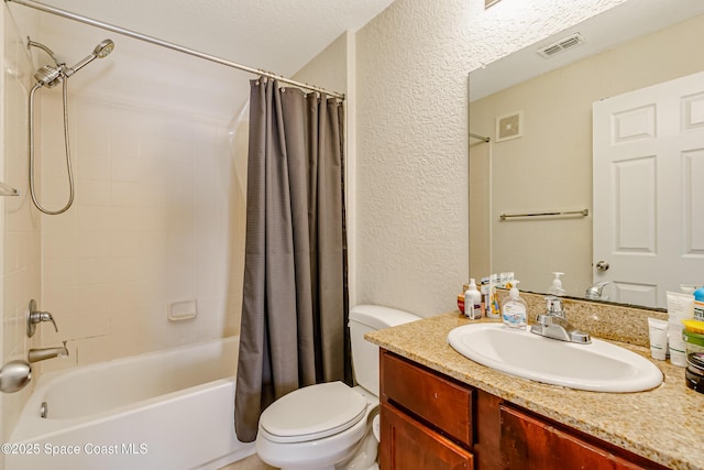 full bathroom with shower / bathtub combination with curtain, vanity, a textured ceiling, and toilet