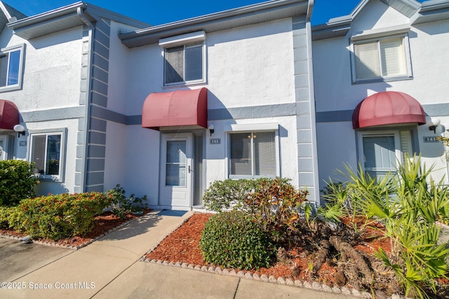 143 Seaport Blvd Unit 20, Cape Canaveral, FL 32920 - view of property with stucco siding