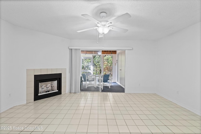 unfurnished living room with a textured ceiling, a fireplace, and ceiling fan