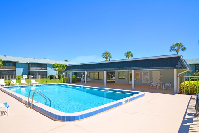 view of swimming pool with a patio area